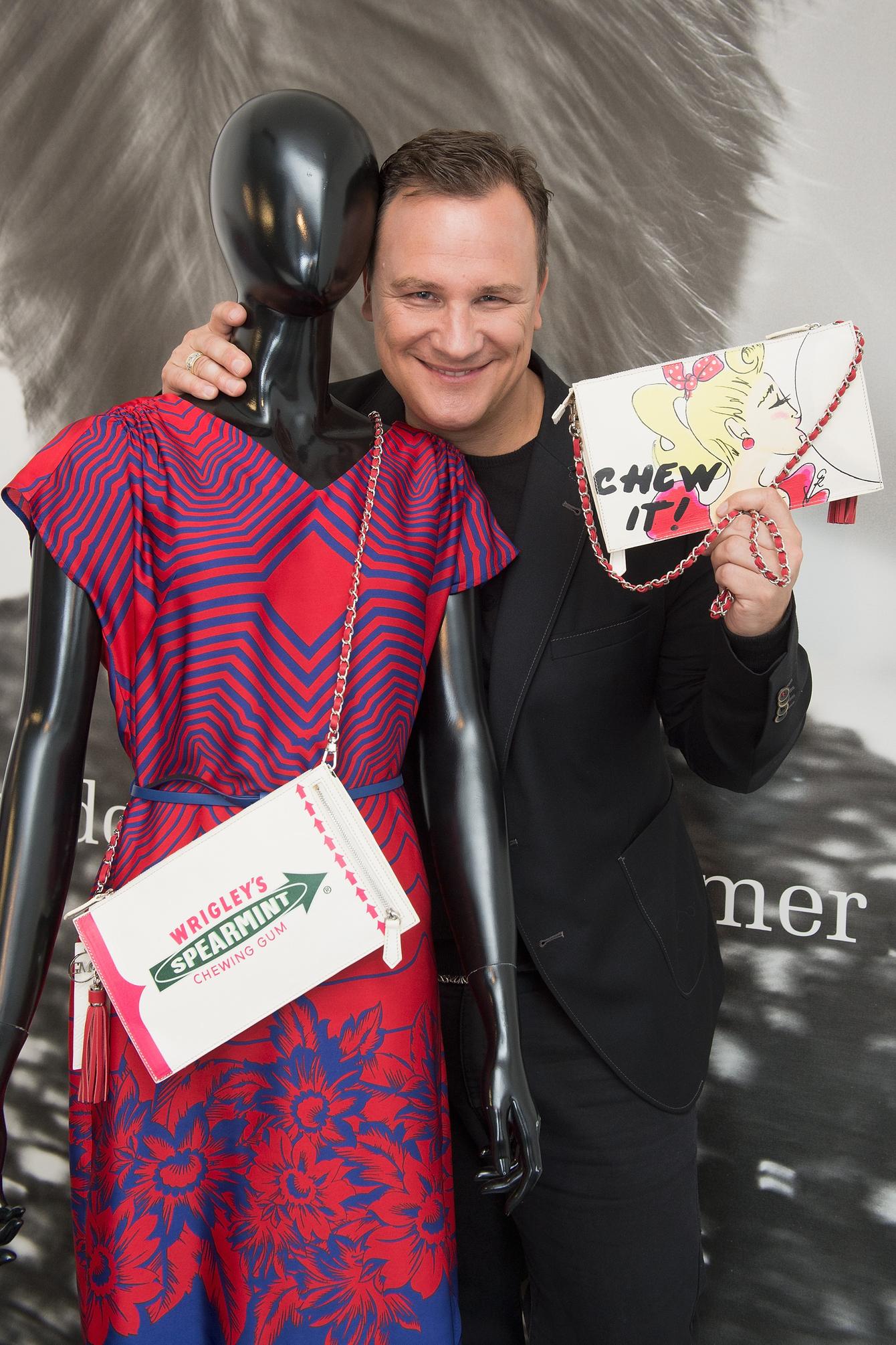 BERLIN, GERMANY - JULY 27: Guido Maria Kretschmer poses with his newly designed clutch for Wrigley's Spearmint on July 27, 2015 in Berlin, Germany. (Photo by Matthias Nareyek/Getty Images for Wrigley's Spearmint) *** Local Caption *** Guido Maria Kretschmer